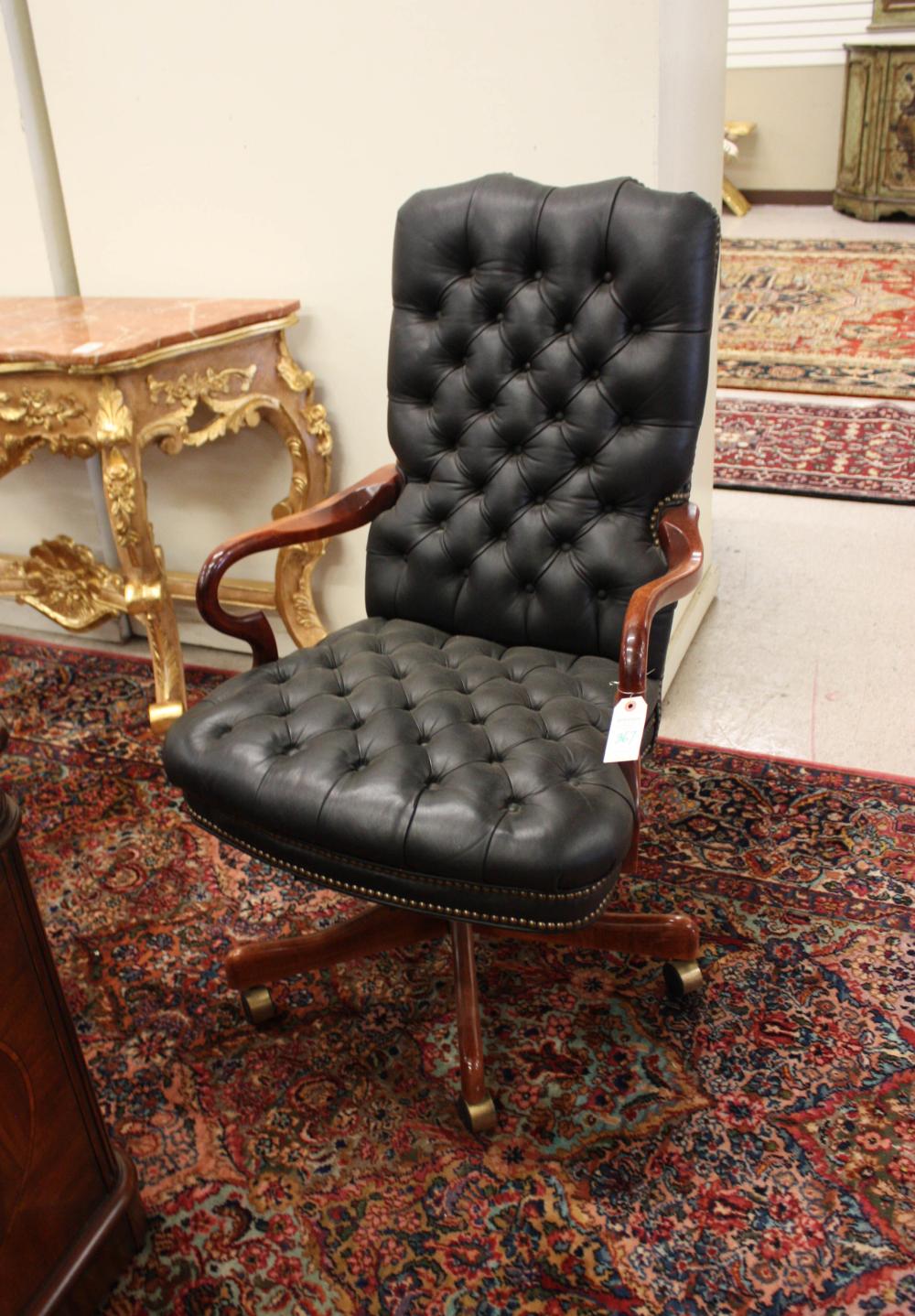 Appraisal: LEATHER UPHOLSTERED MAHOGANY EXECUTIVE DESK ARMCHAIR featuring a buttoned black