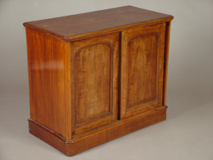 Appraisal: A mahogany side cabinet mid th century the moulded top