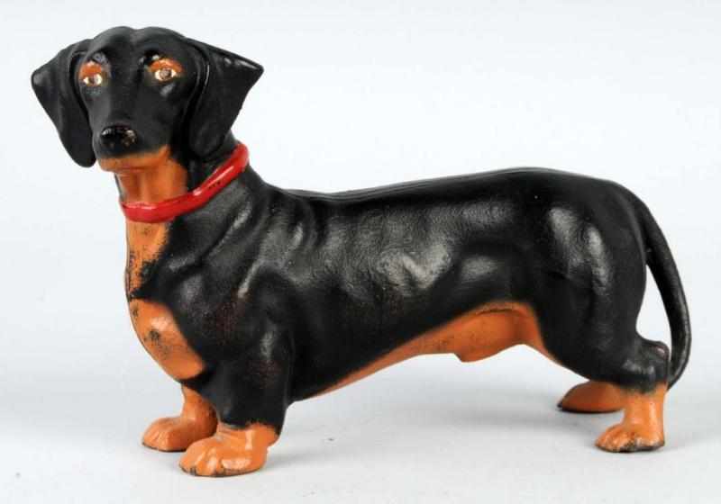 Appraisal: Cast Iron Dachshund Doorstop Description Made by Hubley Repainted Condition