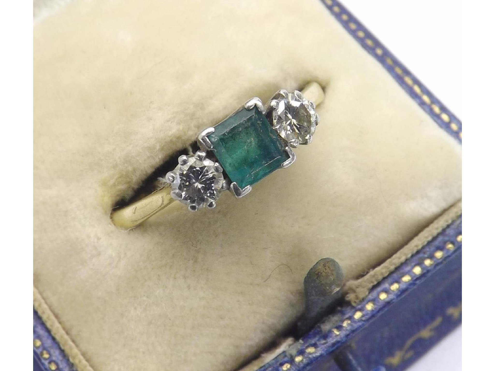 Appraisal: ct and platinum emerald and diamond three stone ring gm