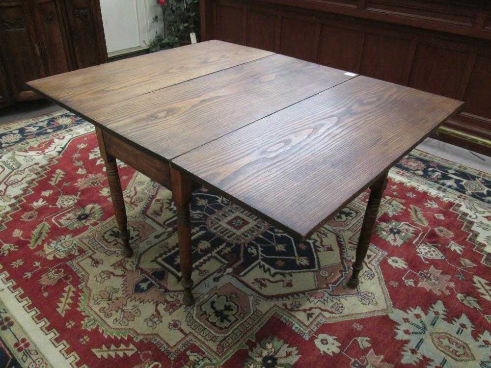 Appraisal: ANTIQUE DROP-LEAF DINING TABLE American th century the side flaps