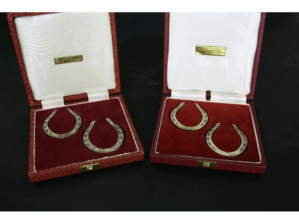 Appraisal: Two cased pairs silver lucky horseshoe serviette rings oz approx