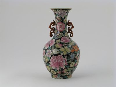 Appraisal: A Chinese millefleurs vase with two reticulated curlicue handles painted