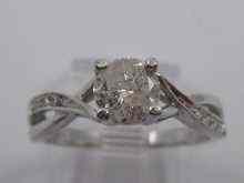 Appraisal: A white metal tests ct gold diamond solitaire ring with