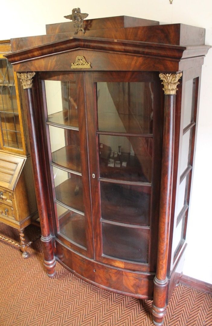 Appraisal: A thC continental flame mahogany display cabinet with a fixed