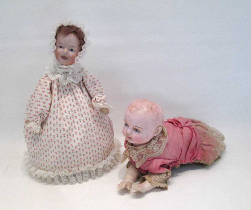 Appraisal: TWO AUTOMATED DOLLS the first a German bisque head doll