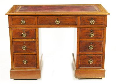 Appraisal: A Victorian walnut pedestal desk with later gilt tooled leather