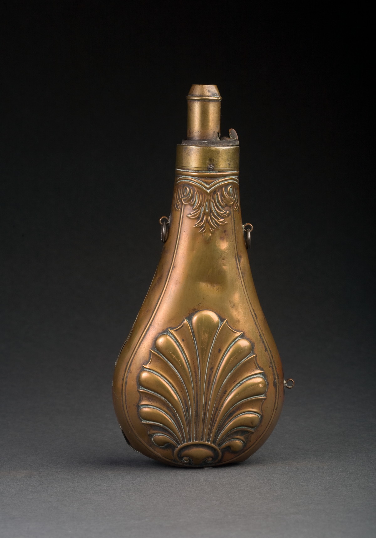 Appraisal: BRASS POWDER FLASK WITH MEASURING SPOUT The flask with large