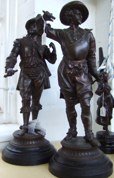 Appraisal: Two patinated spelter figures modeled as King Charles cavaliers a