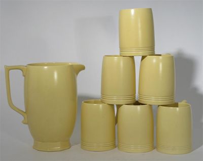 Appraisal: A Wedgwood Matt Straw lemonade set designed by Keith Murray