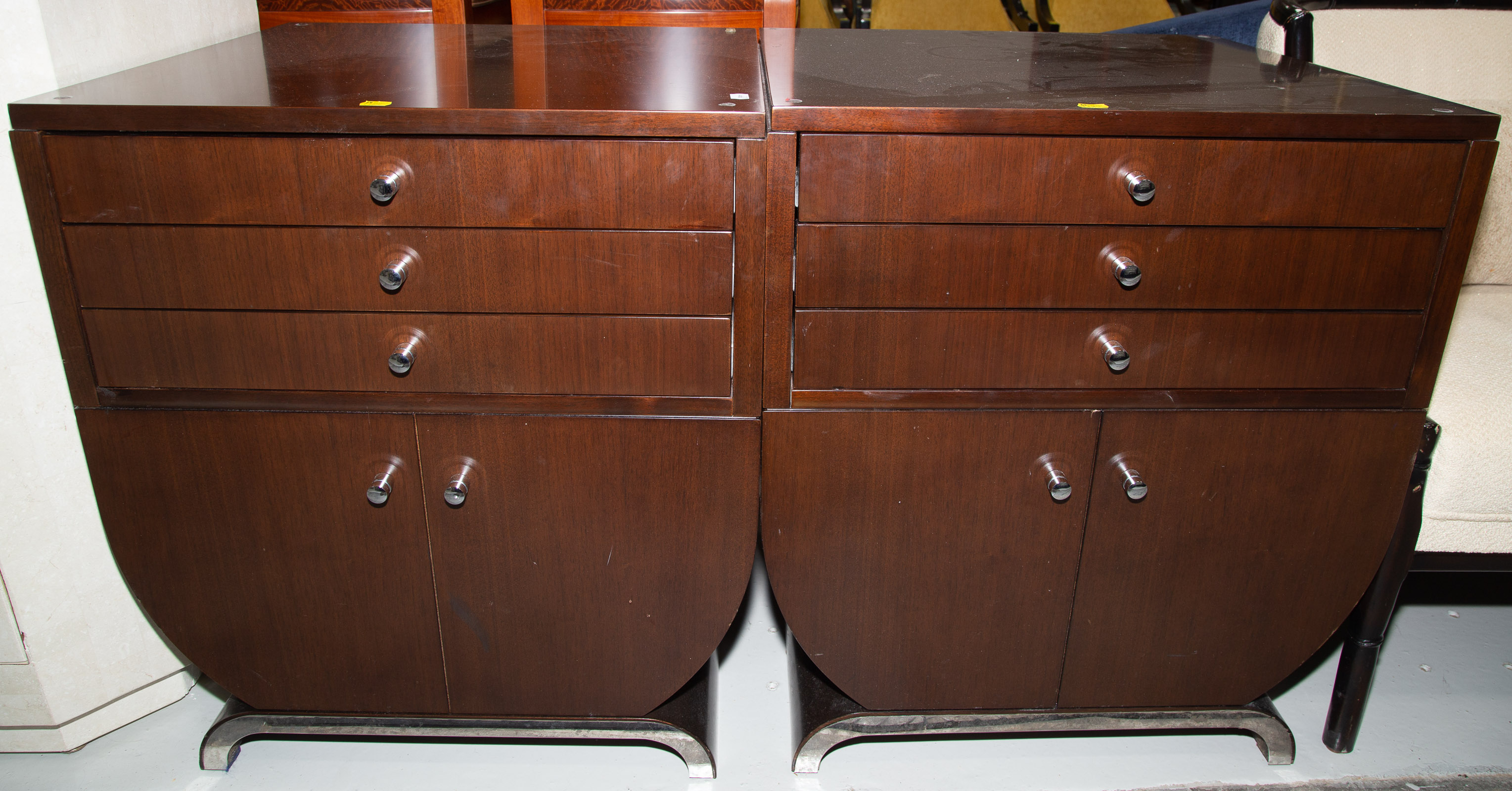 Appraisal: A PAIR OF ART DECO STYLE BEDSIDE CHESTS Modern walnut