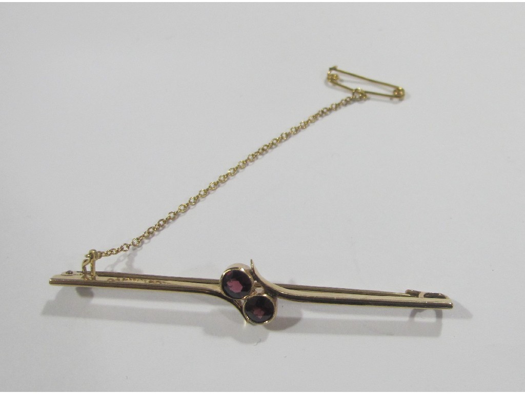 Appraisal: Edwardian gold bar brooch set with two almandine garnets in