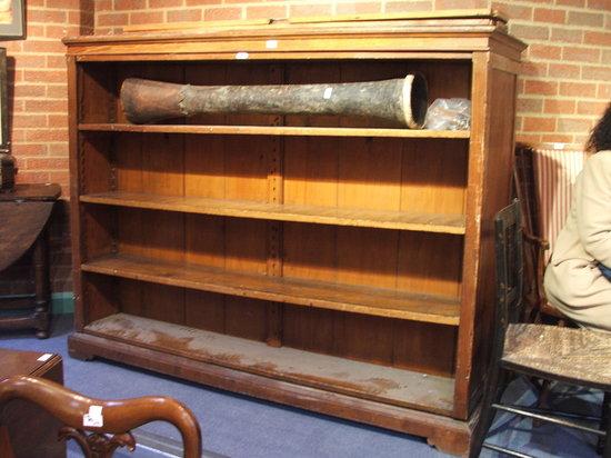 Appraisal: AN INSTITUTIONAL PITCH PINE DOUBLE SIDED FREE STANDING BOOKCASE with