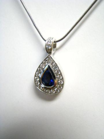 Appraisal: K white gold sapphire and diamond pendant with ct pear-shaped