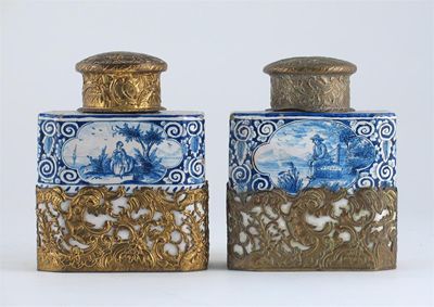 Appraisal: A pair of Dutch Delft tea canisters with metal mounts