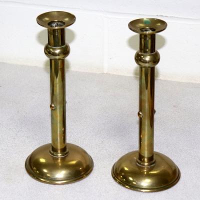 Appraisal: A pair of Arts Crafts brass candlesticks of plain column