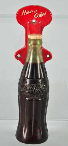 Appraisal: s Coca-Cola Bottle Door Pull Description Metal and plastic Only