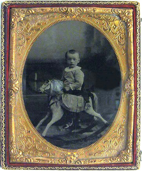 Appraisal: Tin type of a boy on a hobby horse x