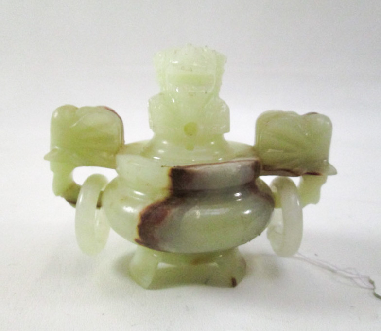 Appraisal: CHINESE CARVED JADE CENSER tri-footed and having elephant mask handles