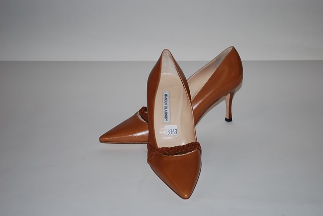 Appraisal: Manolo Blahnik camel colored leather pumps with braid trim Size