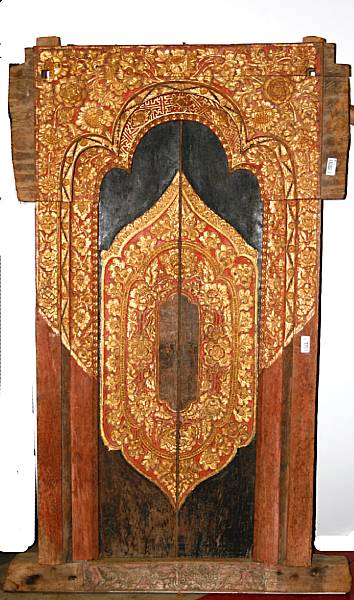 Appraisal: A Southeast Asian gilt and polychrome painted wood pair of