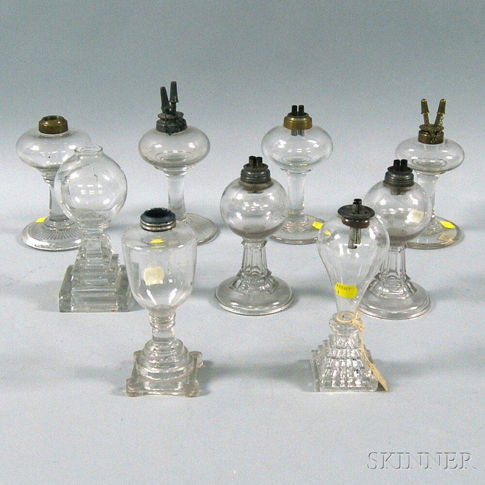 Appraisal: Nine Colorless Blown and Pressed Glass Fluid Lamps th century