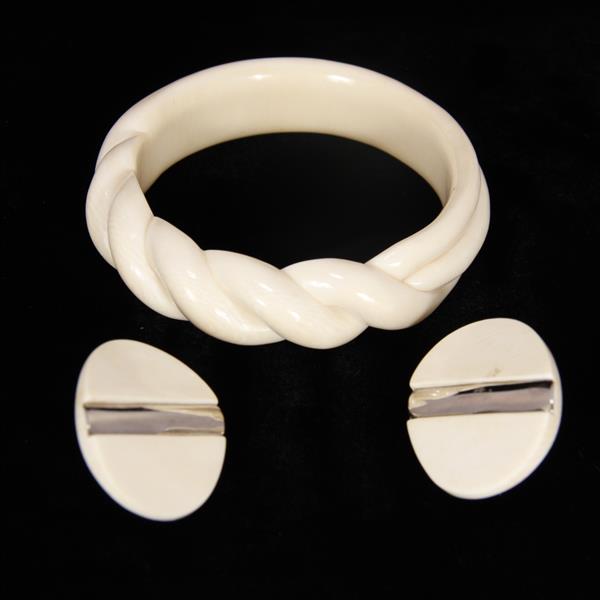 Appraisal: Vintage Modern Designer Couture Carved Ivory Twist Bangle and minimalist