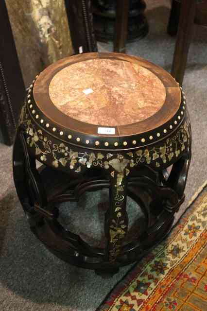 Appraisal: A CHINESE BARREL SHAPED URN STAND with inset rose marble