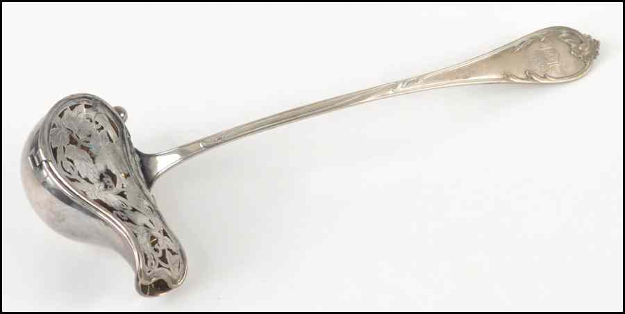 Appraisal: GERMAN SILVER LADLE Bearing a filigree cover over the goldwashed