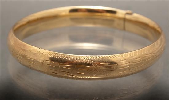 Appraisal: Lady's engraved K yellow gold bangle bracelet grams