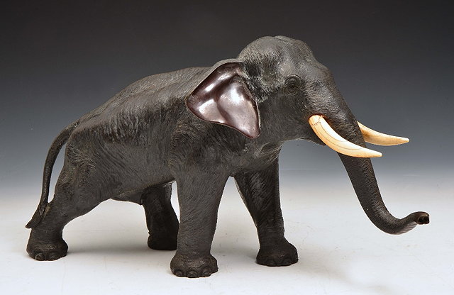 Appraisal: A JAPANESE BRONZE MODEL of a standing elephant signed from