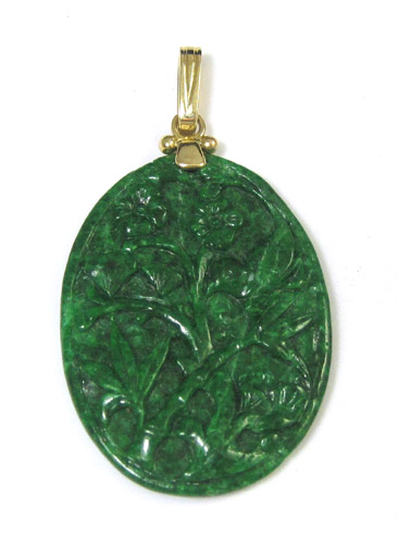 Appraisal: GREEN JADE AND FOURTEEN KARAT GOLD PENDANT having an oval