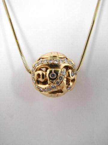 Appraisal: K yellow gold diamond ball pendant on K yellow gold