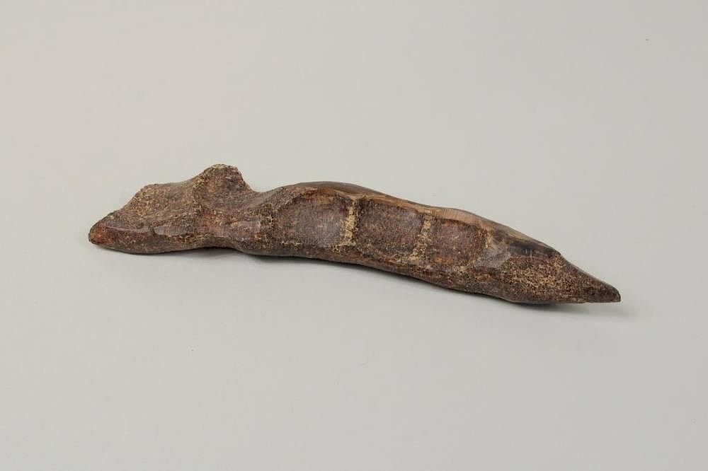 Appraisal: Inuit Carved Whip Handle of Fossilized Material Inuit carved whip