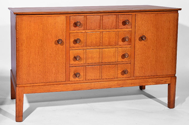 Appraisal: Gordon Russell oak sideboardfour central drawers flanked by cupboards with