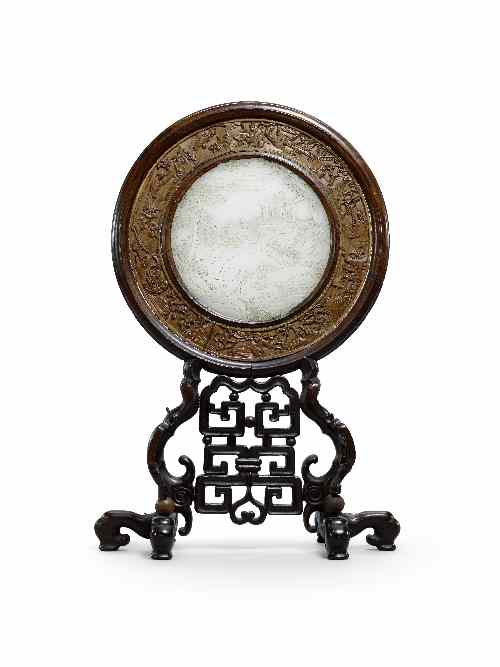 Appraisal: A Chinese circular celadon jade table screen carved with sages