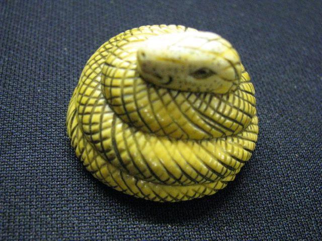 Appraisal: Carved Ivory Netsuke of a Snake coiled signed