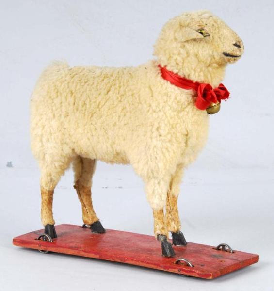 Appraisal: Sheep Pull Toy Description Glass eyes When the head is