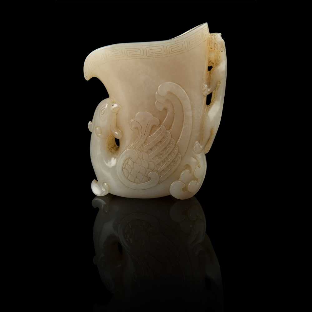 Appraisal: WHITE JADE 'PHOENIX AND CHI DRAGON' LIBATION CUP QING DYNASTY