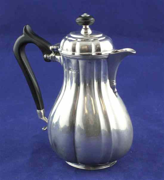 Appraisal: A Victorian silver hot water jug of fluted pear form