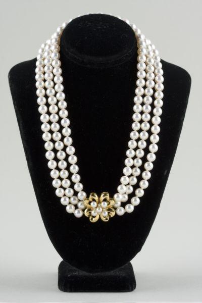 Appraisal: Mikimoto Triple Strand Pearl Necklace with KT yellow gold clasp