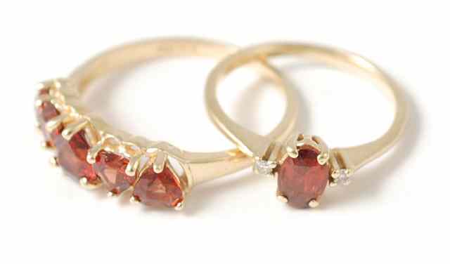 Appraisal: TWO RED GARNET AND FOURTEEN KARAT GOLD RINGS one set