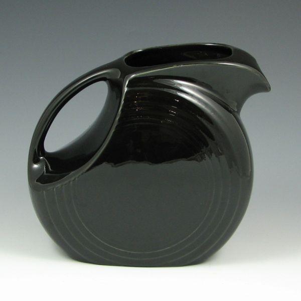 Appraisal: Fiesta large disc pitcher in Black Marked with impressed Fiesta