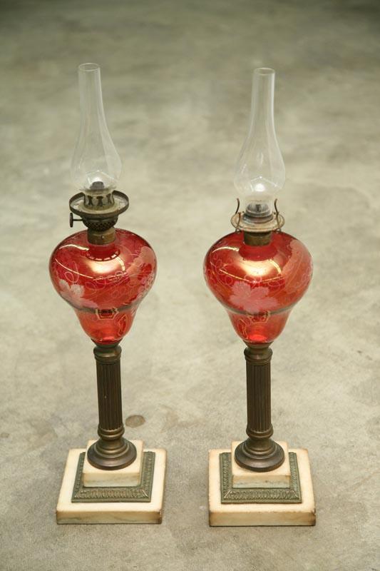 Appraisal: TWO MATCHING OIL LAMPS Marble and brass bases with flashed