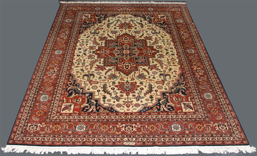 Appraisal: HANDWOVEN PERSIAN TABRIZ WOOL RUG having brick blues navy design