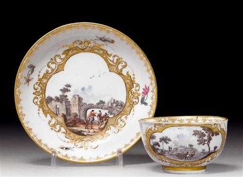 Appraisal: CUP AND SAUCER WITH LANDSCAPE CARTOUCHES Meissen circa The landscapes