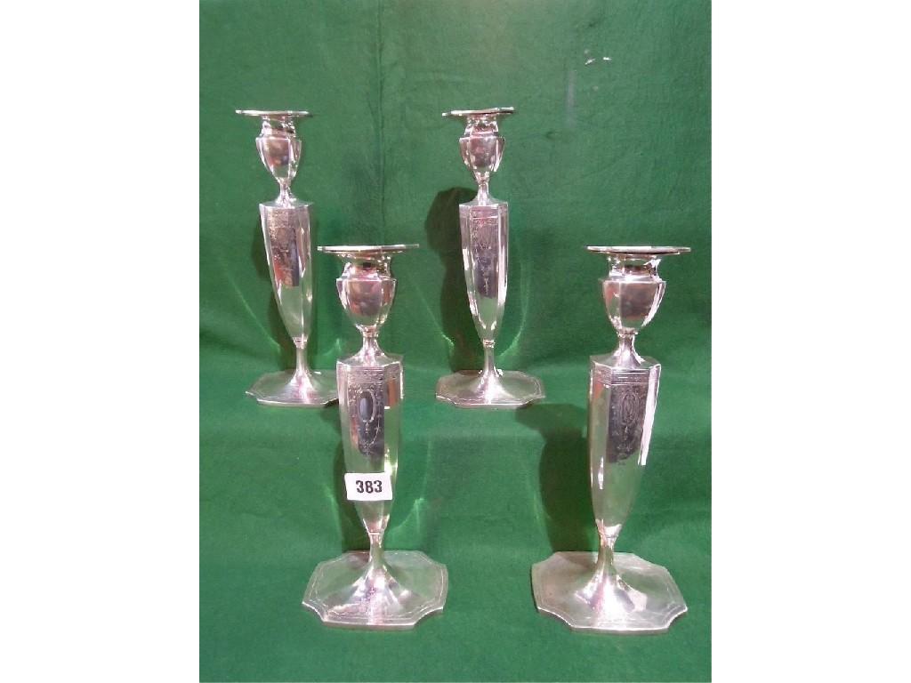 Appraisal: Four th century American silver candlesticks with floral engraved faceted