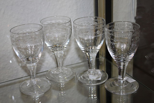 Appraisal: A SET OF FOUR TH CENTURY ETCHED WINE GLASSES