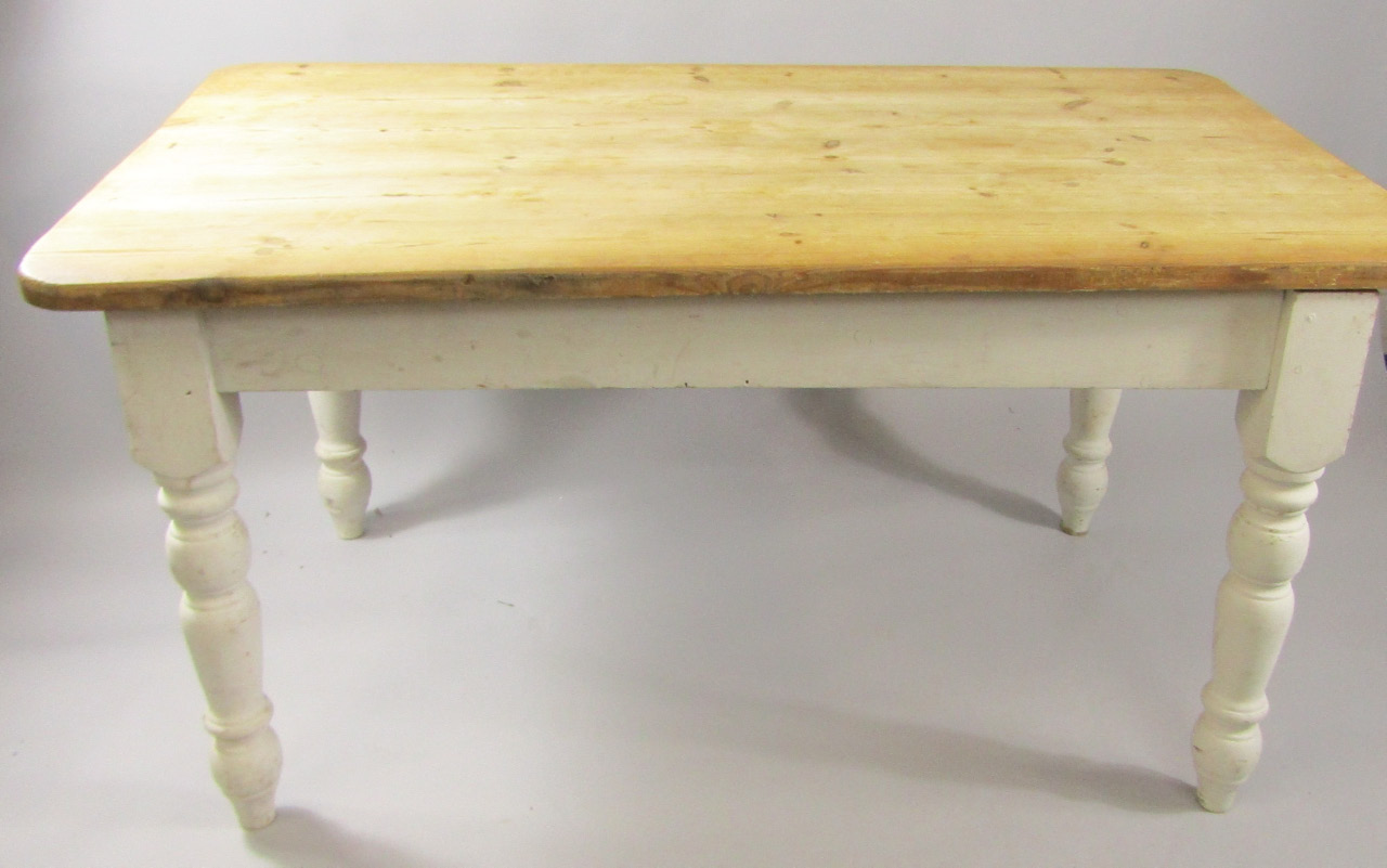 Appraisal: A Victorian pine kitchen table raised on a white painted