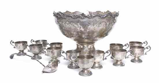 Appraisal: A Silverplate Punch Bowl Set comprising twelve cups a ladle